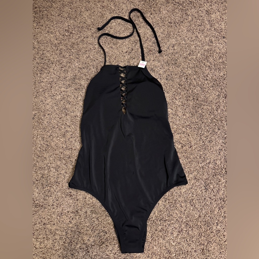 Black Victoria’s Secret one piece swimsuit. Size large